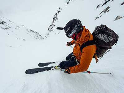 skier skiing down the mountain in arcteryx gear